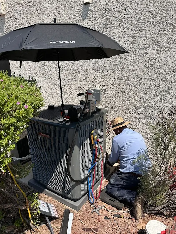 HVAC technician performing outdoor AC maintenance in Orangevale